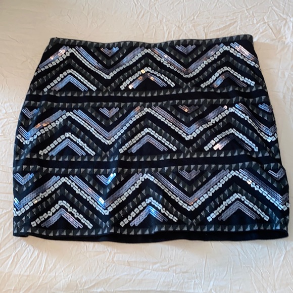 Express Dresses & Skirts - Beautiful soft stretchy mini skirt. Black and silver